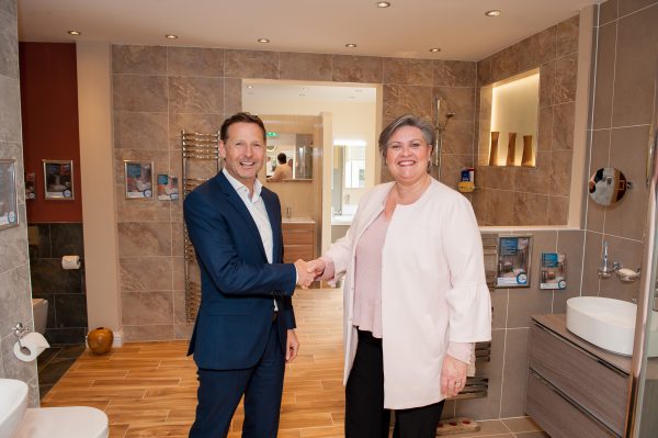 Coucnillor Roz McCall opens the Haddow Bathrooms showroom extension with managing director Lawrence Haddow